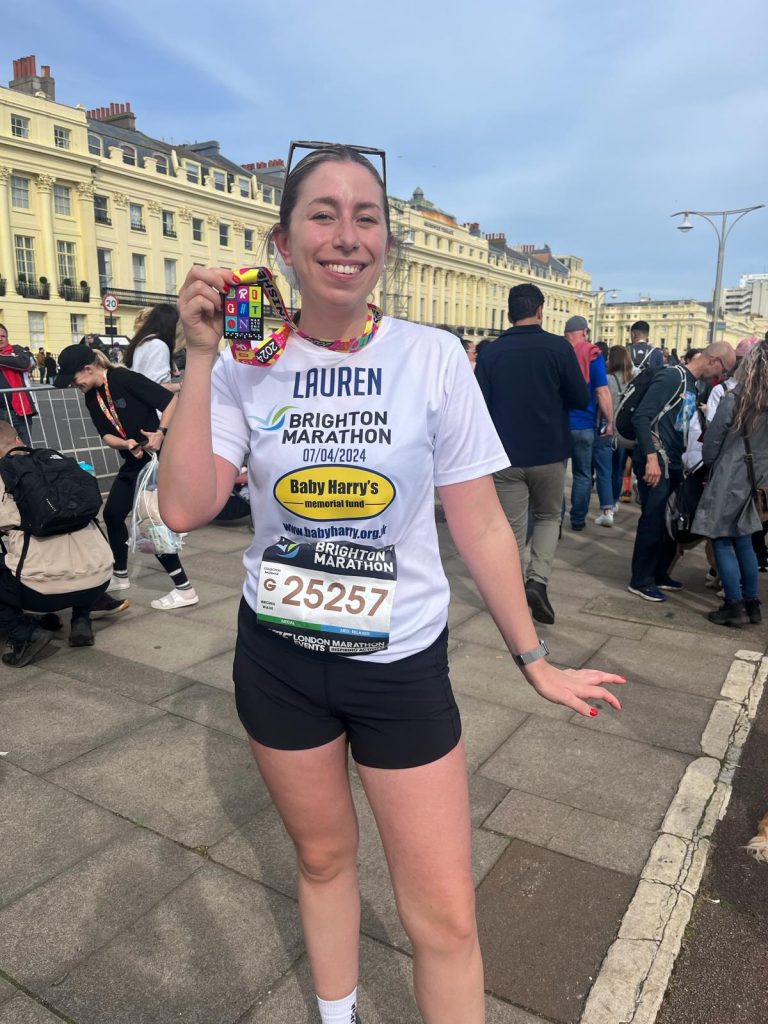Lauren Mitchell running the 2024 Brighton Marathon for the Baby Harry Memorial Fund